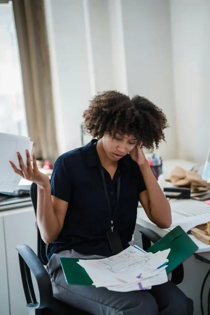 adult female at work struggling to focus on work